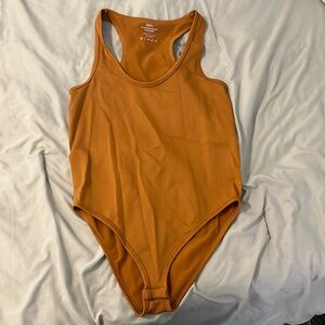 Mustard yellow body suit